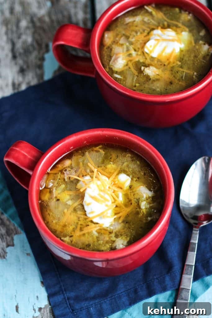 Instant Pot Soup Recipes You’ll Actually Love 36 green chicken chili in red mugs