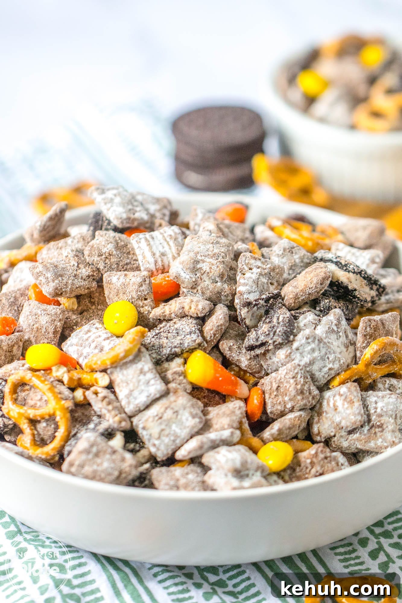 Autumn Puppy Chow: Cozy No-Bake Snack Mix Recipe 8 Angle shot of a large white bowl with fall puppy chow mix