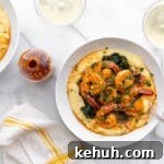 Coconut sriracha shrimp and kale in bowls over grits, with sriracha on the side