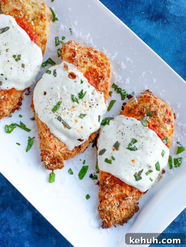 Baked Chicken Parmesan Baked parm chicken with marinara sauce and cheese
