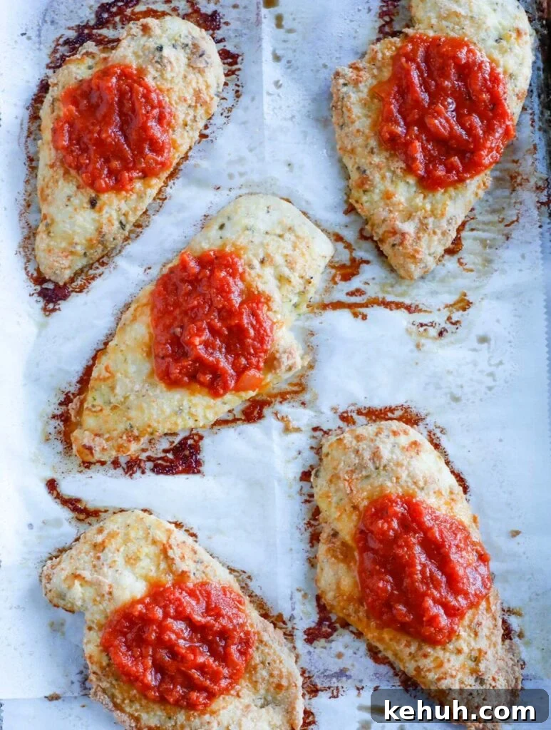 Baked Chicken Parmesan top down shot of baked chicken parm on tray