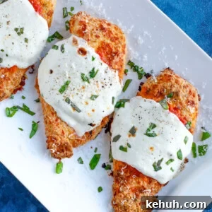 Classic Chicken Parmesan Recipe: Crispy, Cheesy & Homemade 2 Baked parmesan chicken with marinara sauce and cheese