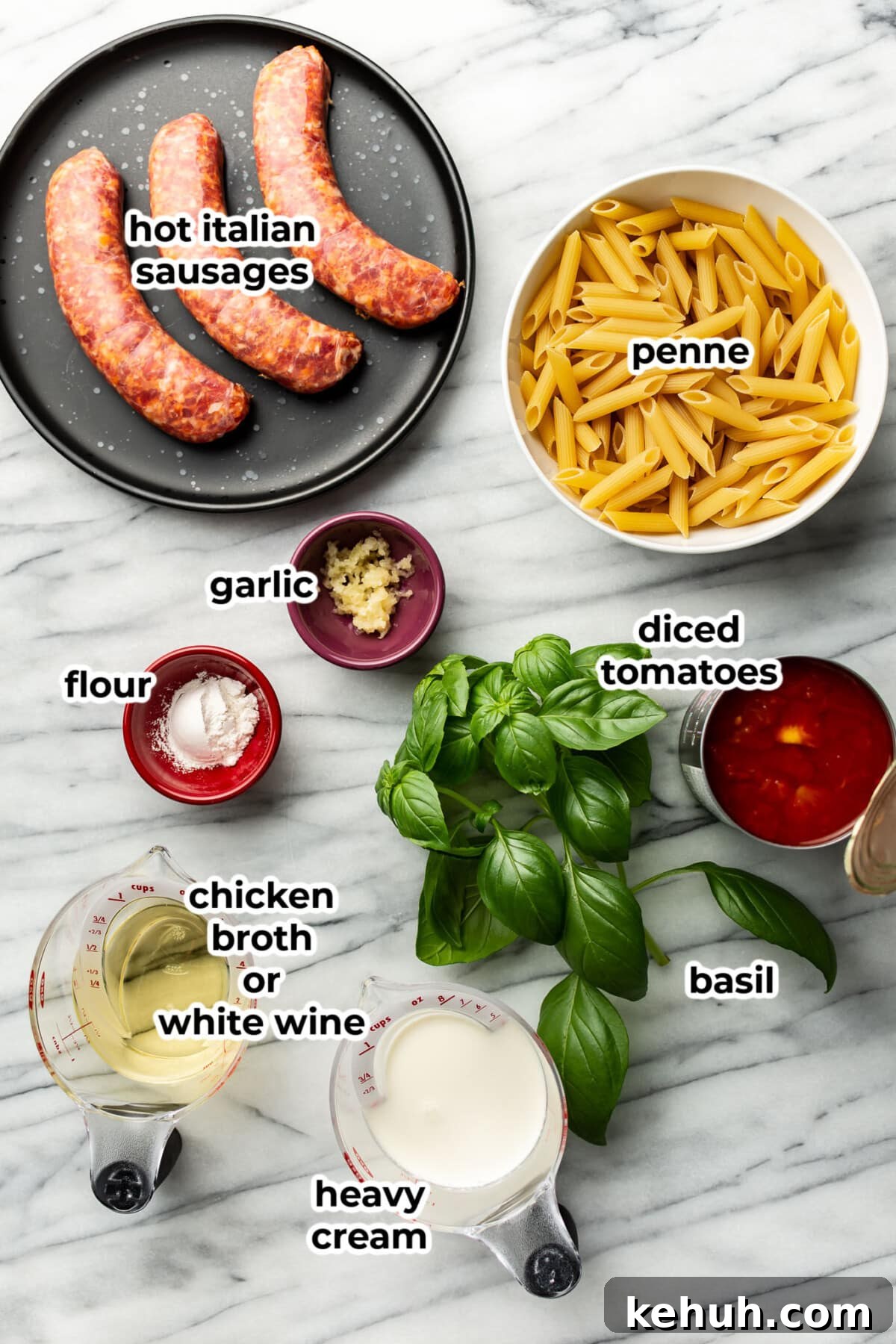 ingredients for spicy italian sausage pasta in prep bowls