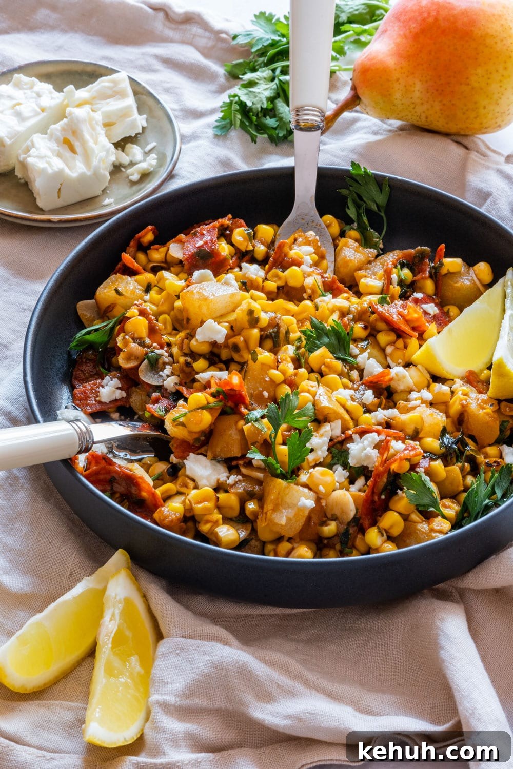 Grilled Corn Salad with Cherry Tomatoes and Lime Vinaigrette 2 Homemade grilled corn salad with pears on the plate.