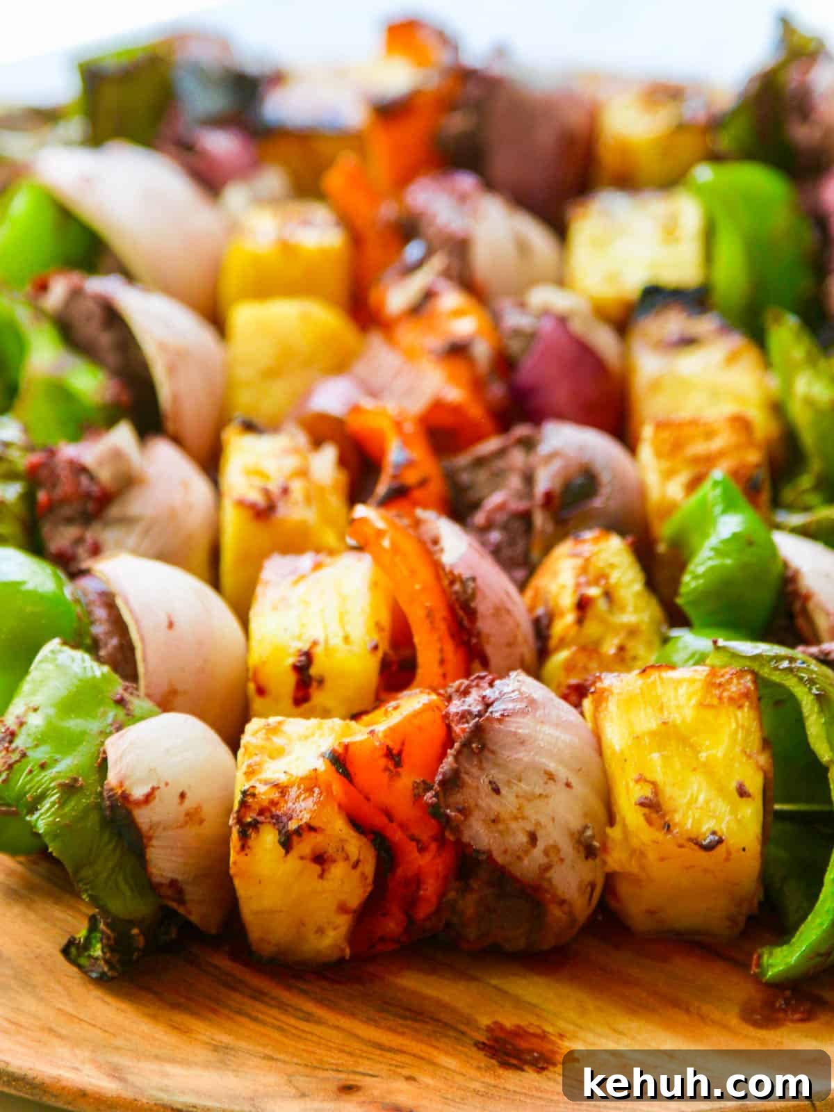 Grilled skewer shish kabobs made with beef, bell pepper, pineapple, and onion.