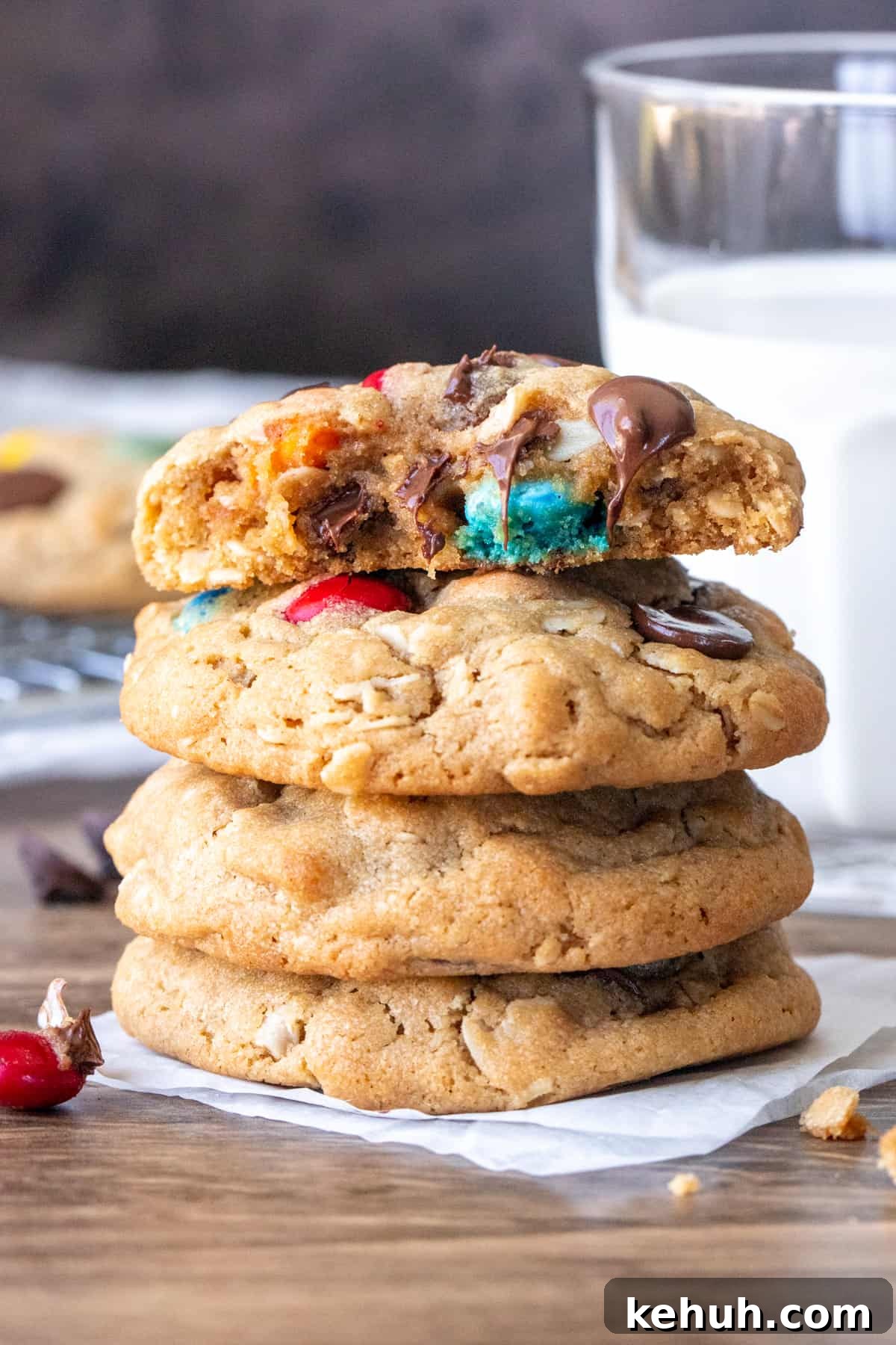 Stack of monster cookies with top cookie broken in half