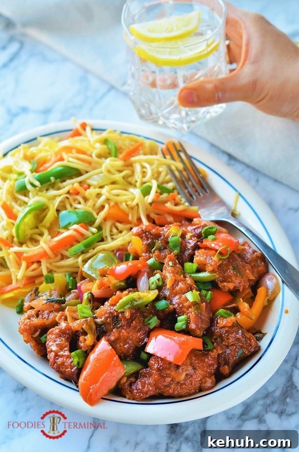 Air fryer Indo Chinese Chilli chicken served with noodles