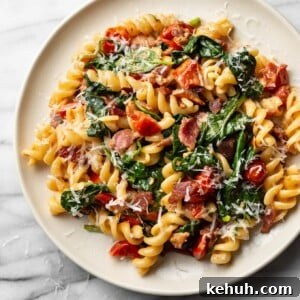 BLT pasta on a beige plate