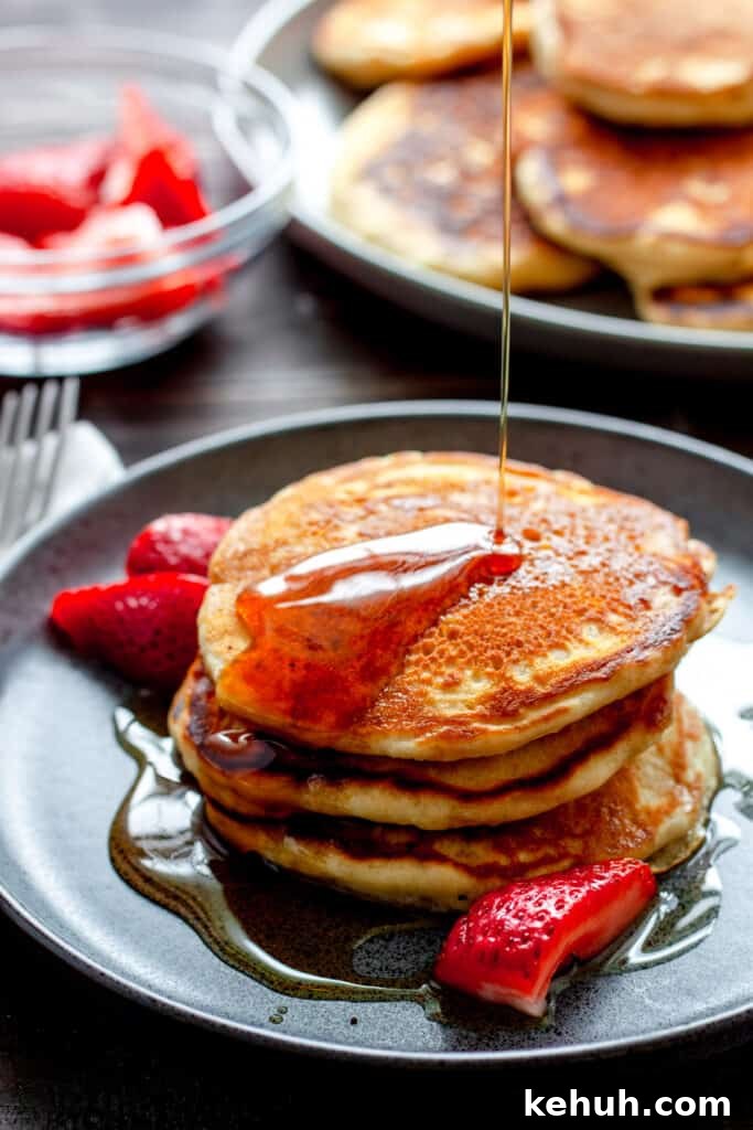 Brioche French Toast Casserole Recipe for Brunch and Holidays 12 A light and fluffy stack of oat milk pancakes drizzled with maple syrup.