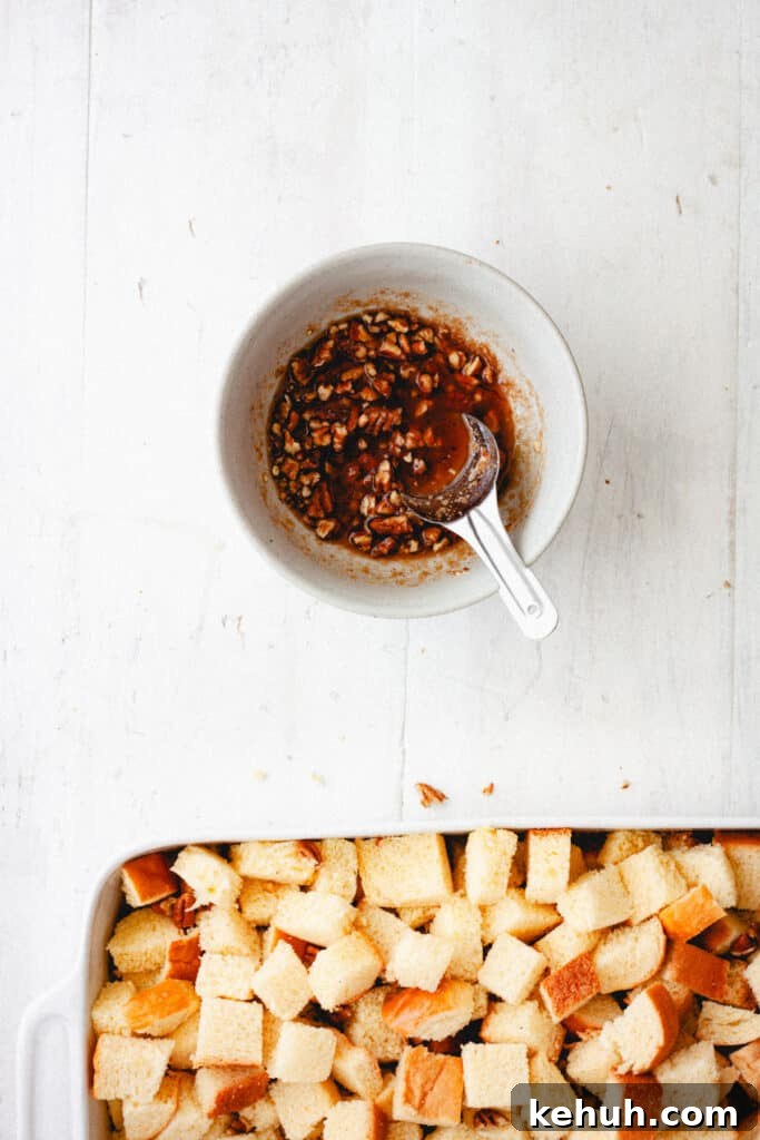 Brioche French Toast Casserole Recipe for Brunch and Holidays 7 A small bowl with pecan and brown sugar topping for a brioche french toast casserole.