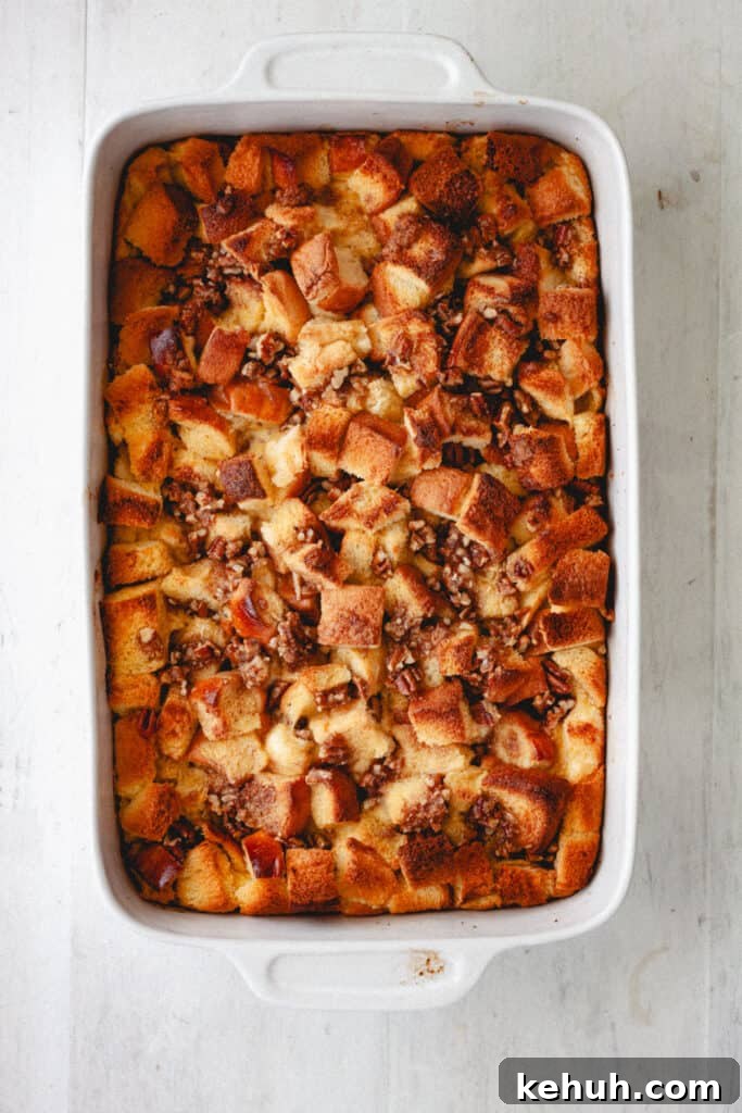Brioche French Toast Casserole Recipe for Brunch and Holidays 10 A cooked brioche French toast casserole on a white table.