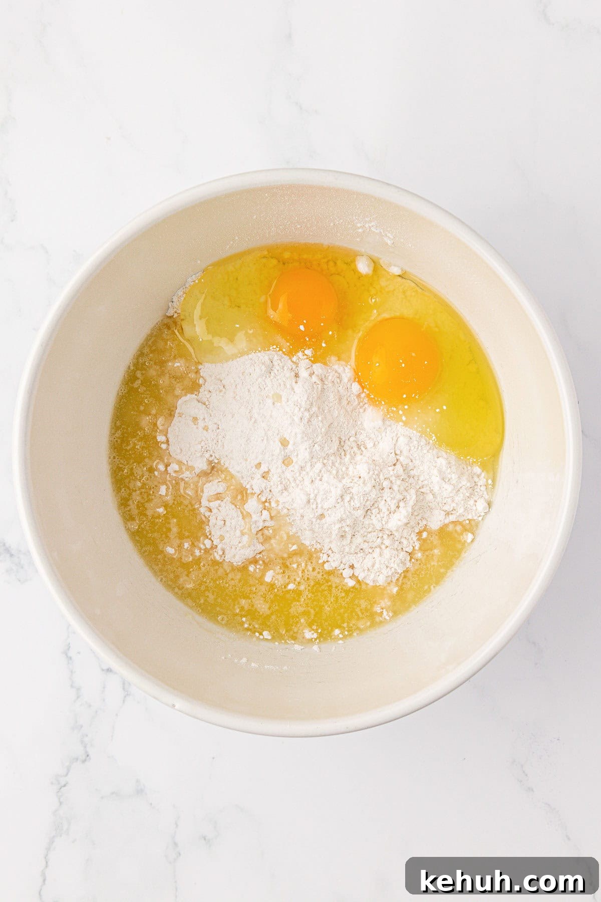 eggs, cake mix, and melted butter in a mixing bowl