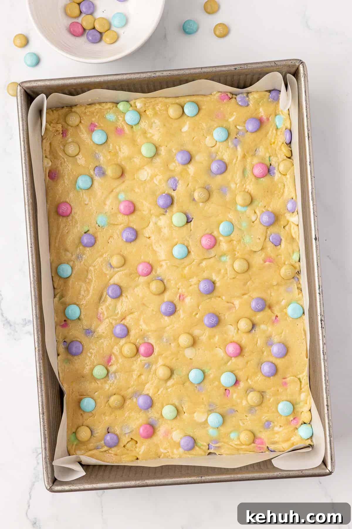 cookie bar batter topped with Easter m&m's