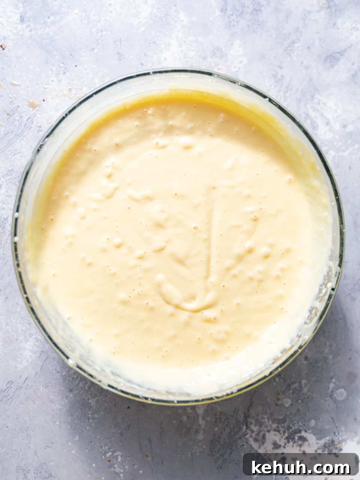 Tangy Lemon Bars with Crisp Graham Cracker Crust 6 creamy lemon filling mixed together in a large mixing bowl.