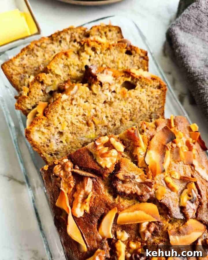 Close up of a half sliced loaf of banana bread