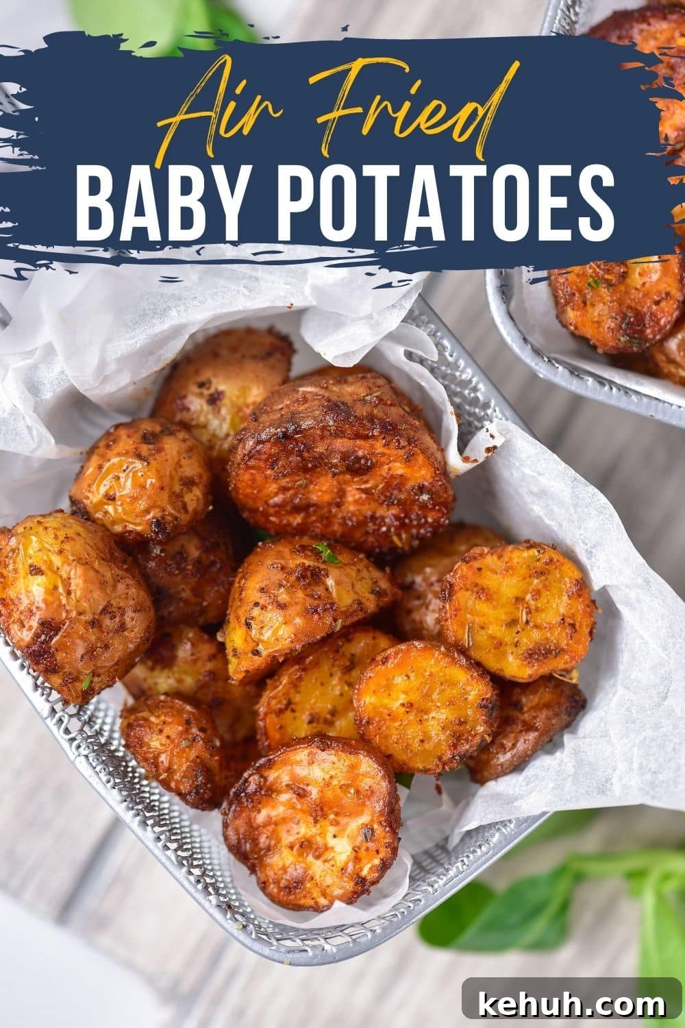 Crispy Air Fryer Baby Potatoes Recipe for Perfectly Roasted Bites 2 baby potatoes covered in seasoning that have been air fried in an air fryer basket