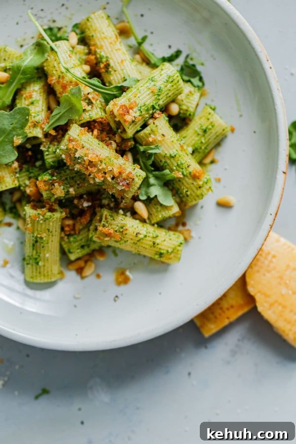 Arugula Pesto Pasta plated with garlicky breadcrumbs Arugula Pesto Pasta on Plate