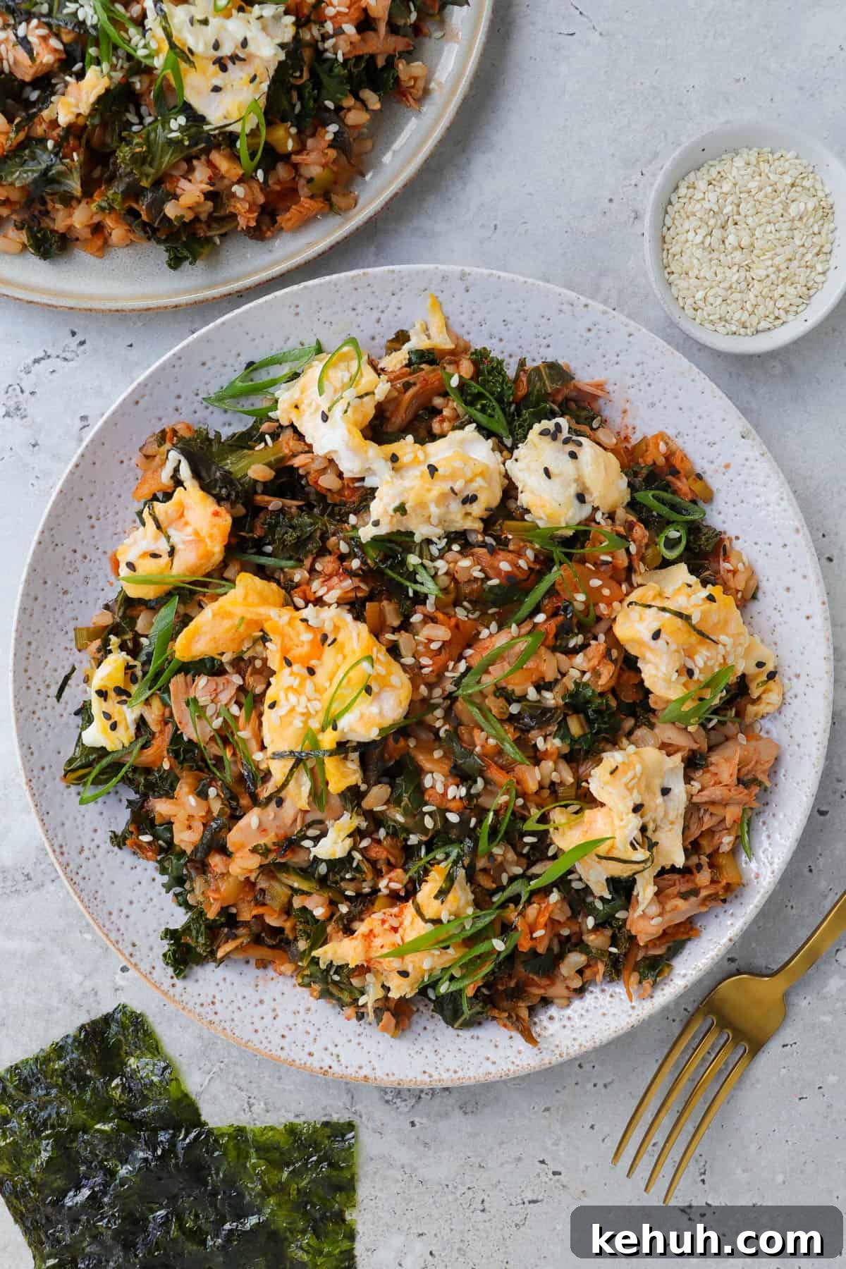 Spicy Tuna and Kimchi Fried Rice Recipe for Quick Weeknight Meals 3 Kimchi fried rice on plate with fork.