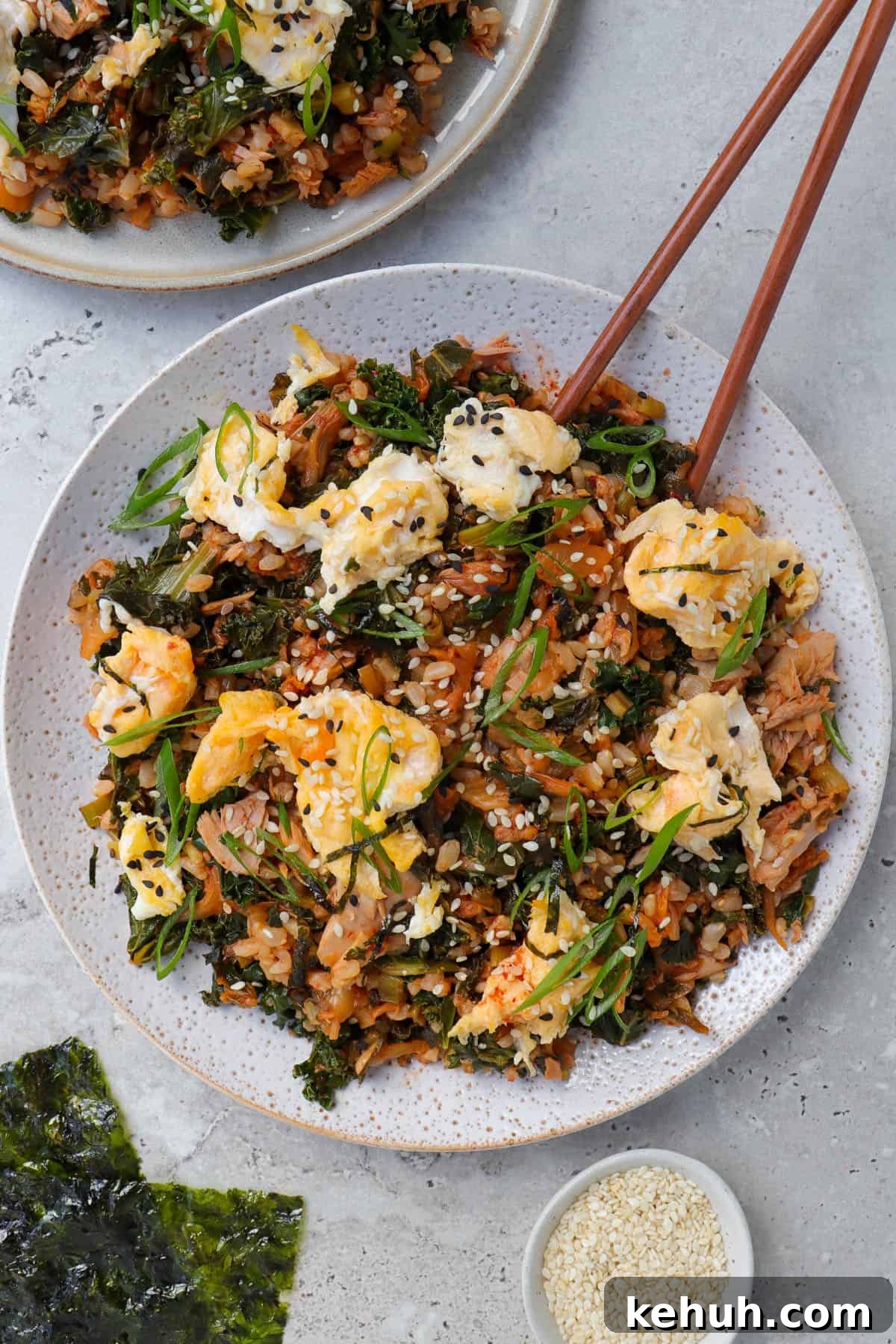 Spicy Tuna and Kimchi Fried Rice Recipe for Quick Weeknight Meals 8 Kimchi fried rice on plate with chop sticks.