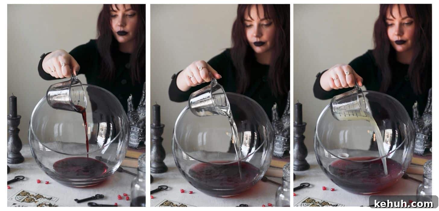 Spooky Witches Brew Punch Recipe for Halloween Parties 4 Three images making witches brew cocktail punch. In photo 1, a woman dressed as a witch is pouring blueberry liqueur into a punch bowl on a white counter next to black candles, Halloween decorations, and tarot cards. In photo 2, she's adding tequila to the bowl. In photo 3, she's adding lemon juice.