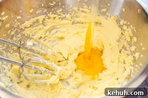 Thumbprint Cookies with Jam, Curd, or Chocolate Filling 5 Butter, sugar and egg being whisked in a silver bowl to make our cookie mix