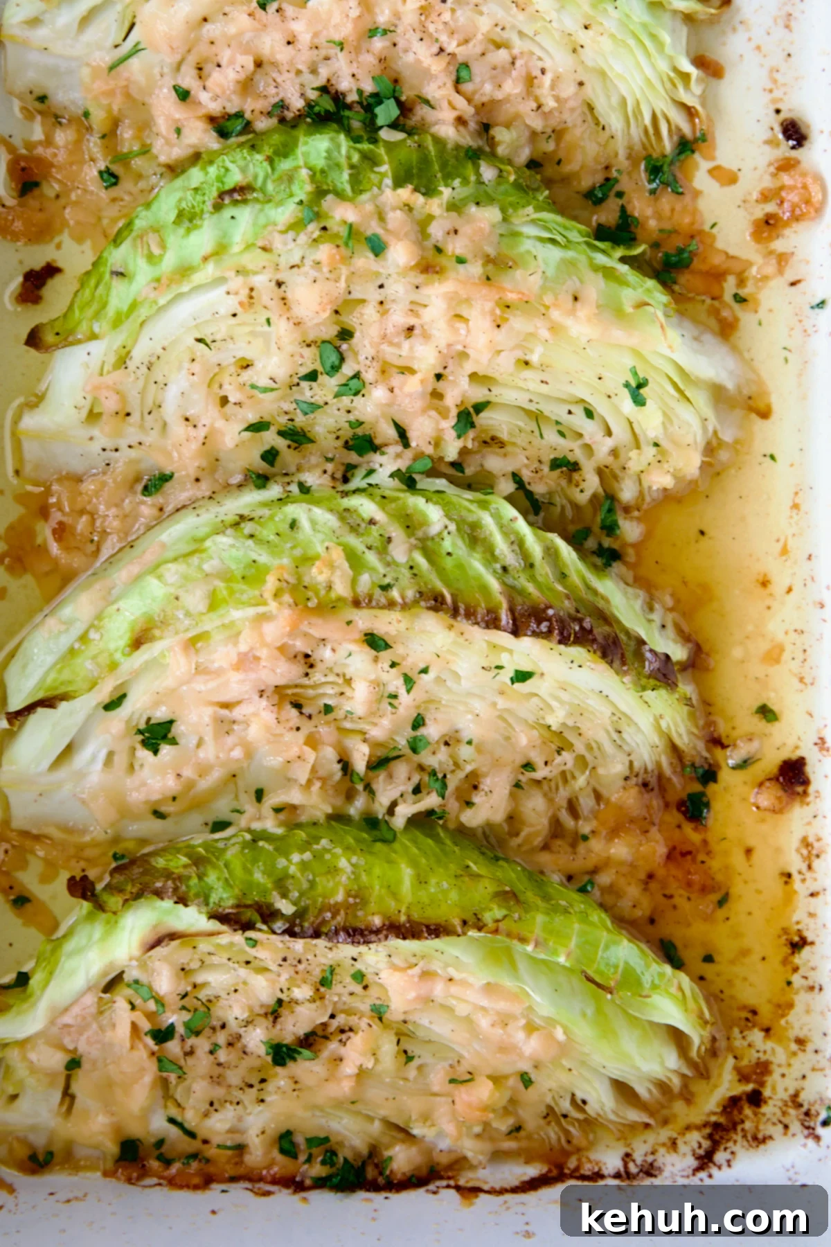 Three wedges of Baked Garlic Parmesan Cabbage Wedges.