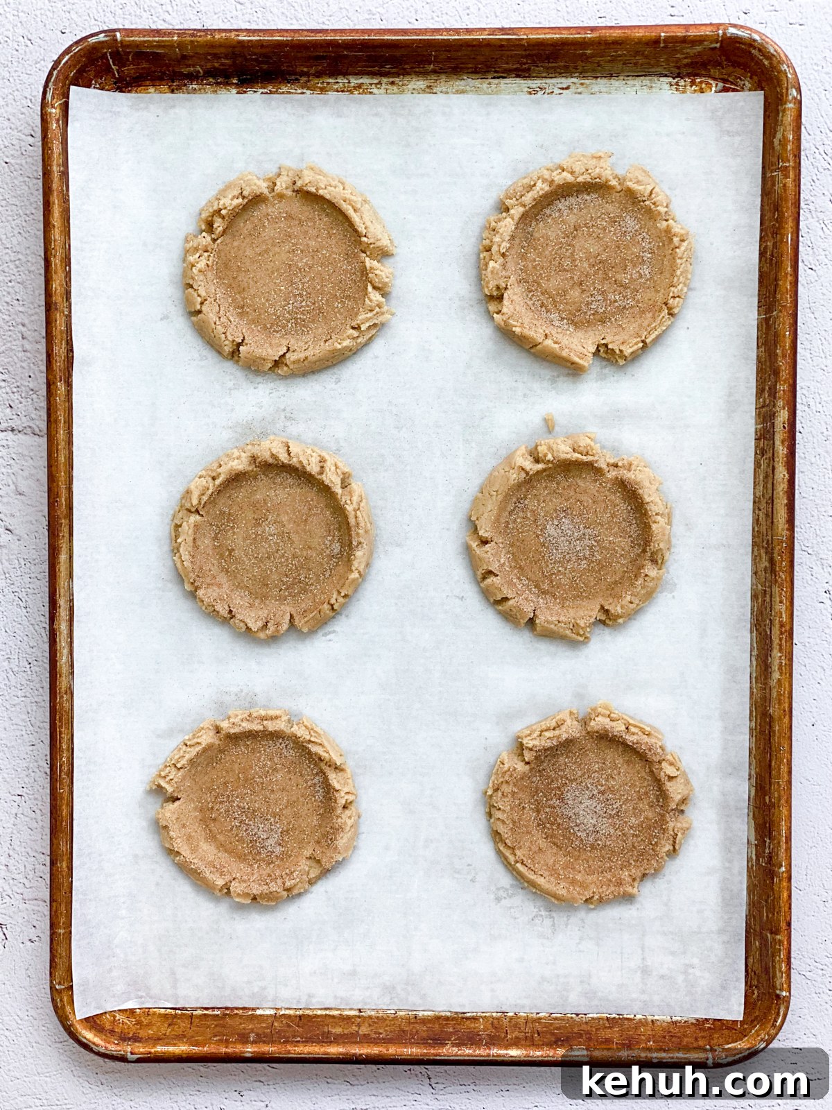 Soft Apple Cider Cookies Recipe with Warm Spices 11 cookies on baking sheet before baking.