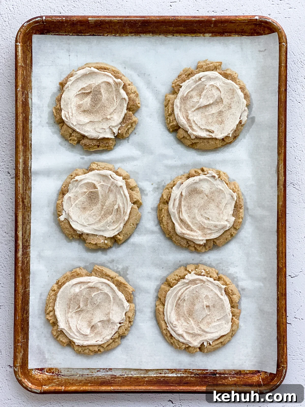 Soft Apple Cider Cookies Recipe with Warm Spices 14 cookies after being frosted.