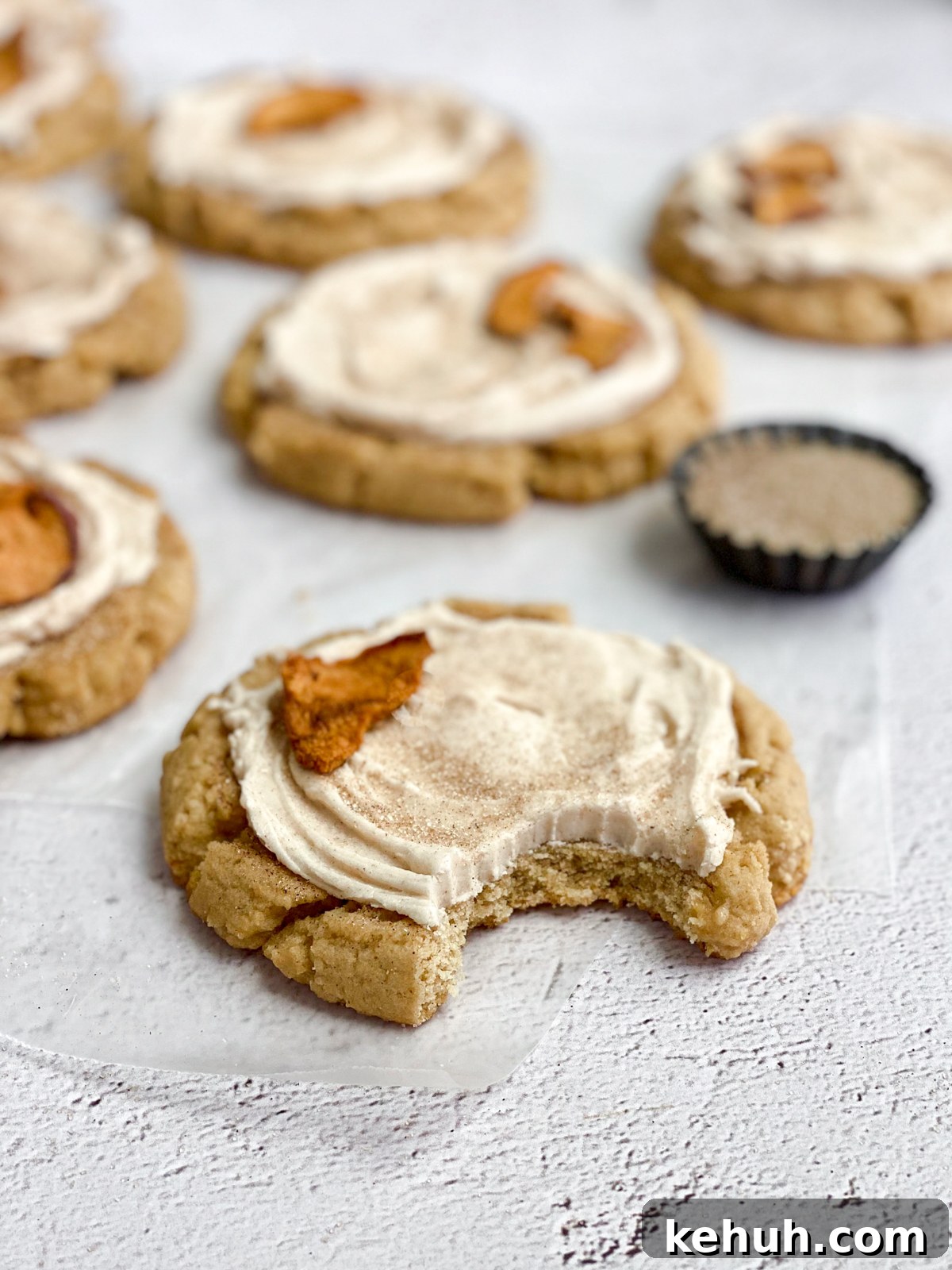 Soft Apple Cider Cookies Recipe with Warm Spices 15 a side view of an apple cider cookie with a bite missing.