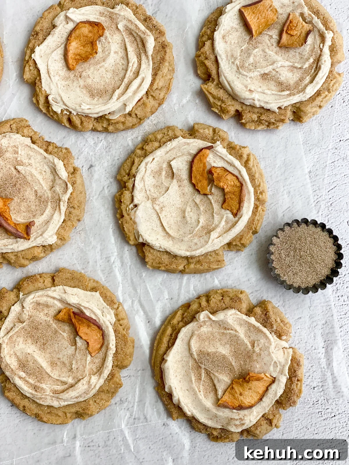 Soft Apple Cider Cookies Recipe with Warm Spices 16 apple cider cookies on some parchment paper.