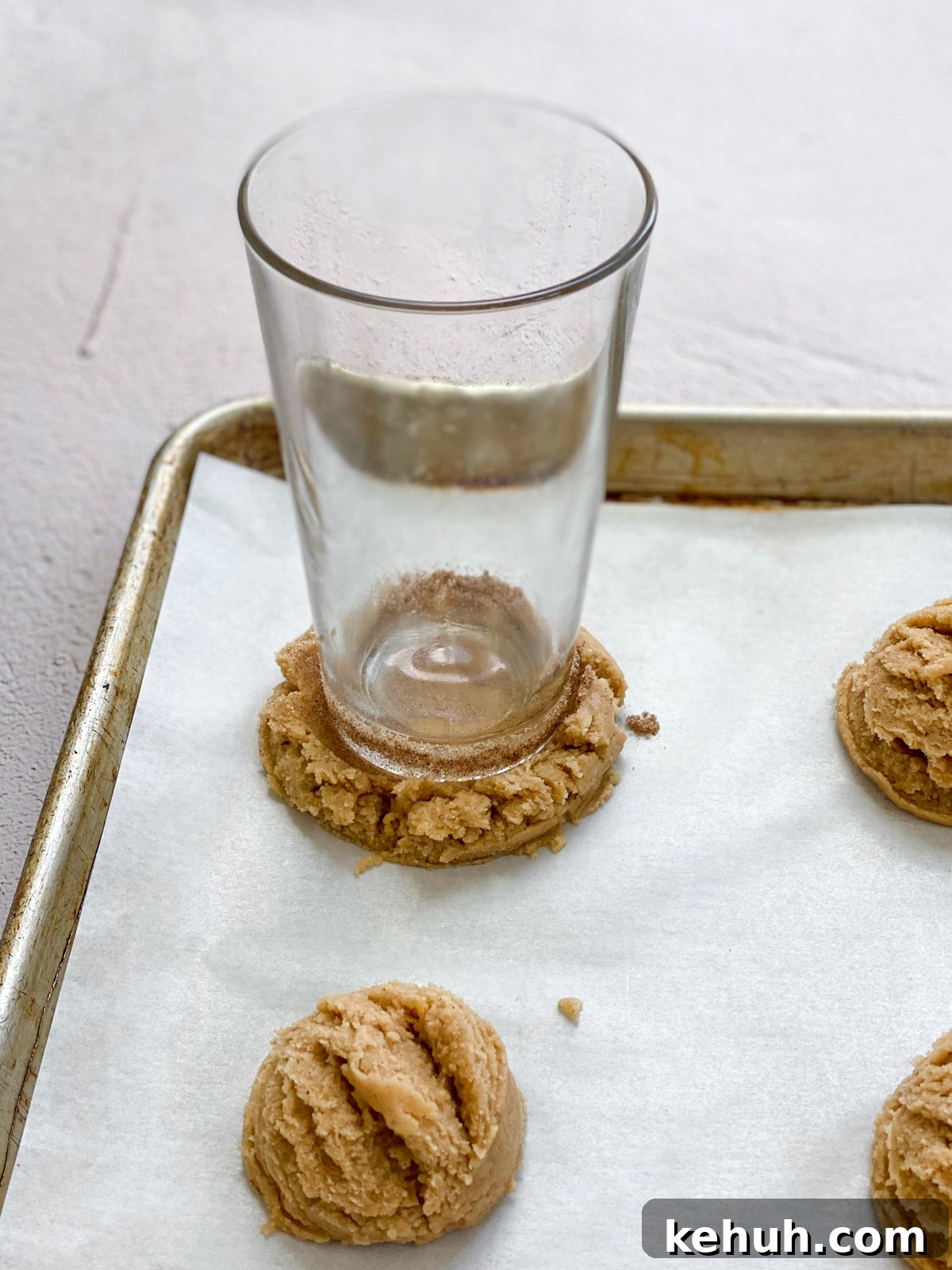 Soft Apple Cider Cookies Recipe with Warm Spices 10 glass on cookie dough.