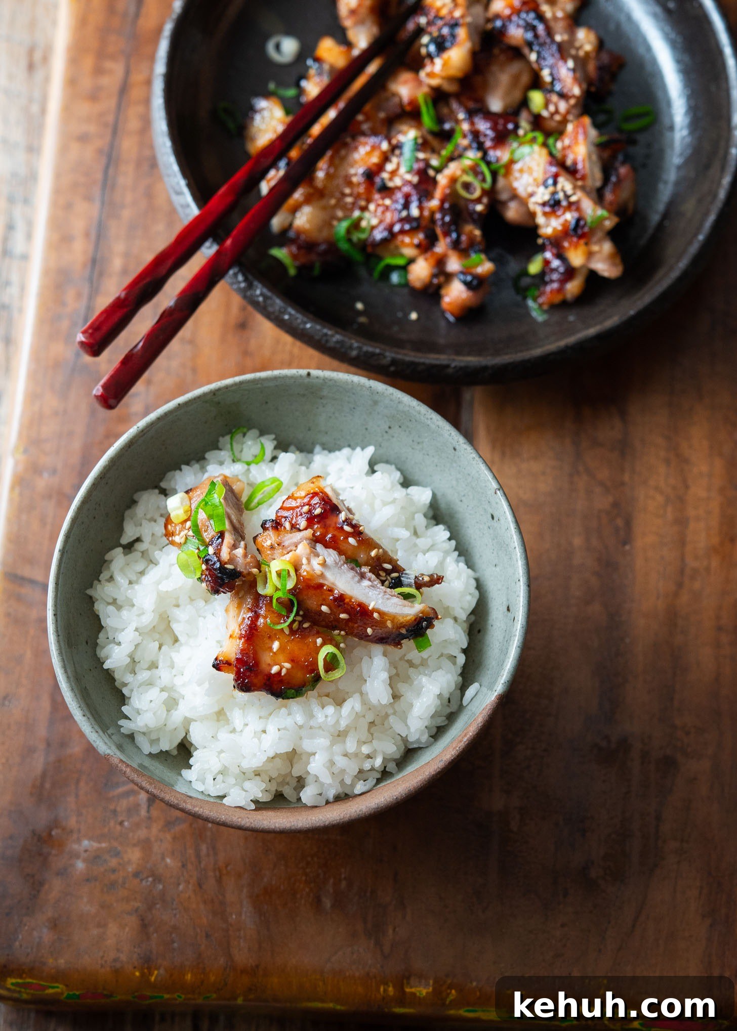 Bowl of rice topped with sliced miso chicken thighs