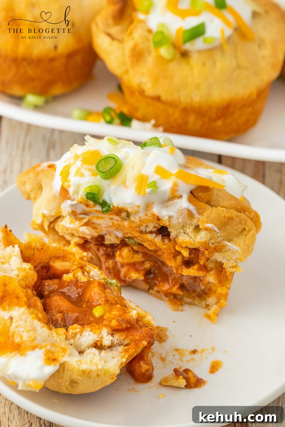 Spicy Chili-Stuffed Dinner Rolls: Savory Bite-Sized Appetizers 10 Chili stuffed rolls! Buttery biscuits surrounding chili and cheese, topped with sour cream and green onions.