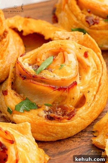 Spicy Chili-Stuffed Dinner Rolls: Savory Bite-Sized Appetizers 12 Baked Turkey and Cheese Rolls have melted cheese, bacon, and turkey covered in a garlic buttery glaze! The perfect party appetizer idea!