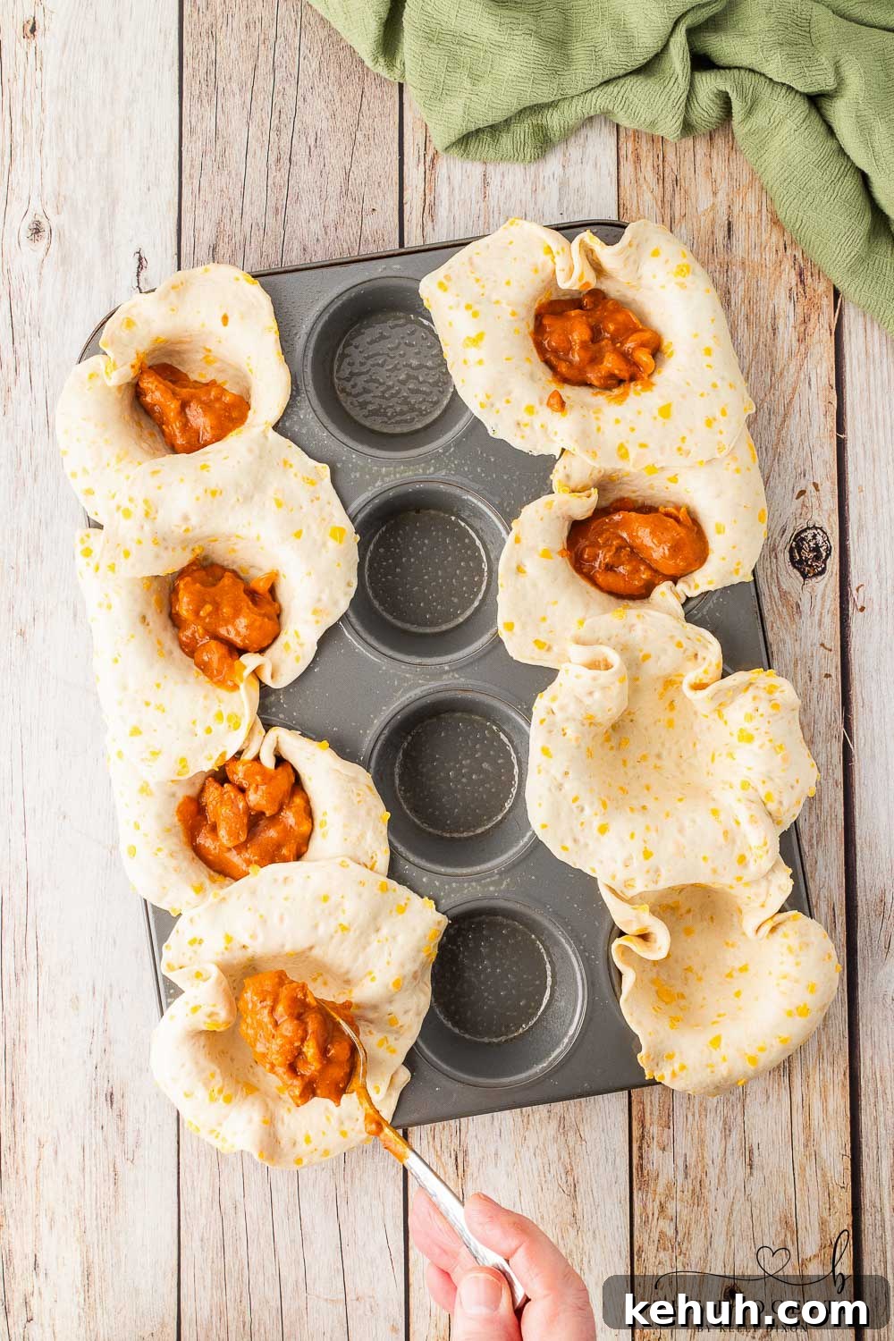 Spicy Chili-Stuffed Dinner Rolls: Savory Bite-Sized Appetizers 6 Add chili to the muffin tin