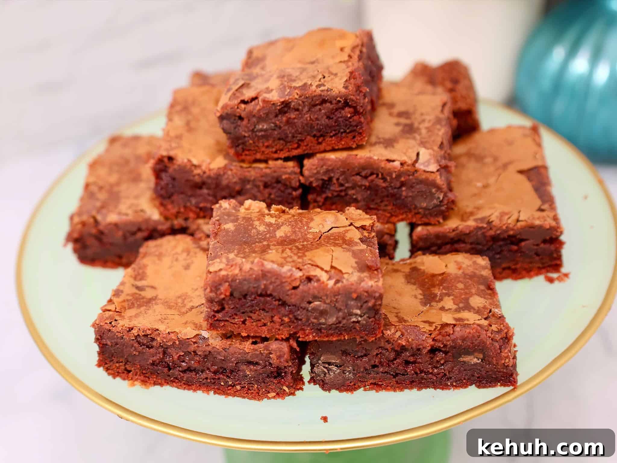 slice of red velvet gooey butter cake showing the creamy chocolate cream cheese filling