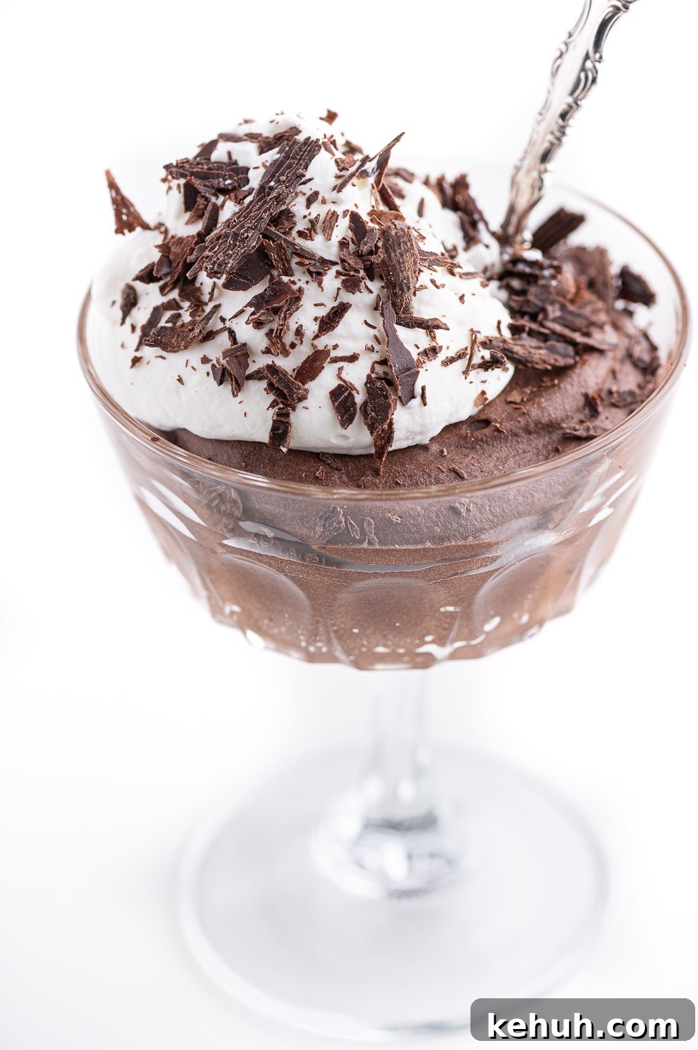 Keto Chocolate Mousse Recipe Without Eggs — Silky & Low-Carb 2 Keto chocolate mousse in a crystal stemmed serving dish with a dollop of fresh whip cream and dark chocolate shavings.