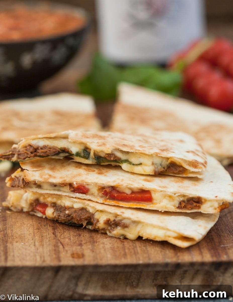 Italian Beef & Roasted Red Pepper Quesadilla Recipe 5 cut quesadilla stacked on top of each other