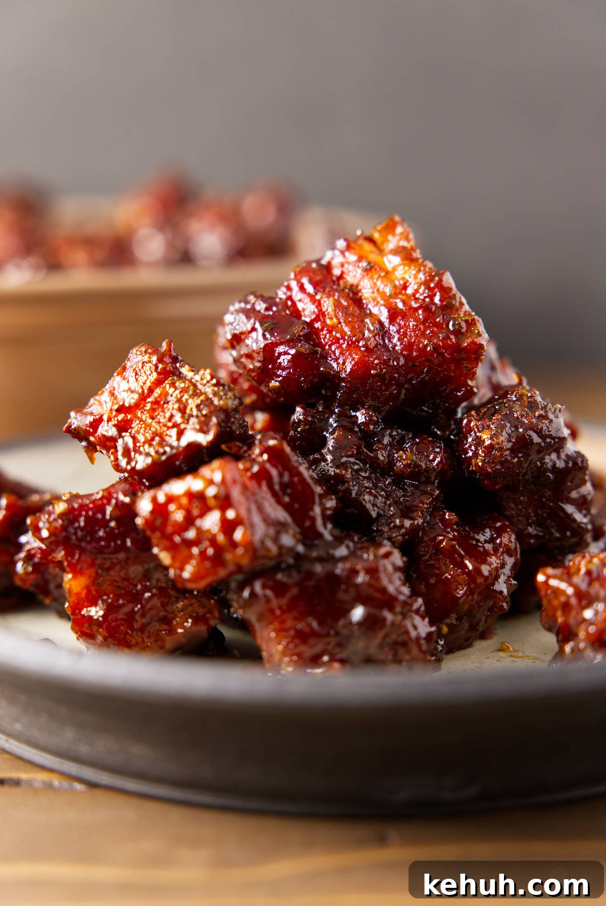 Pile of pork belly burnt ends on a plate.