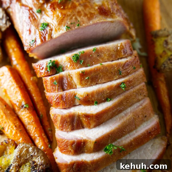 sliced whole smoked pork loin on cutting board