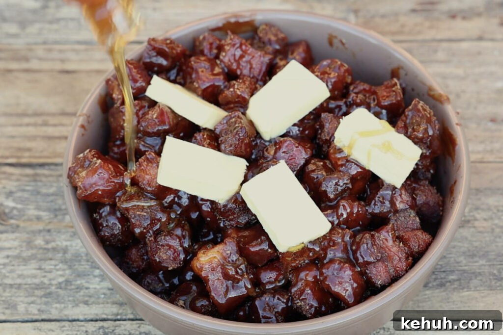 Adding honey to burnt ends in pan.