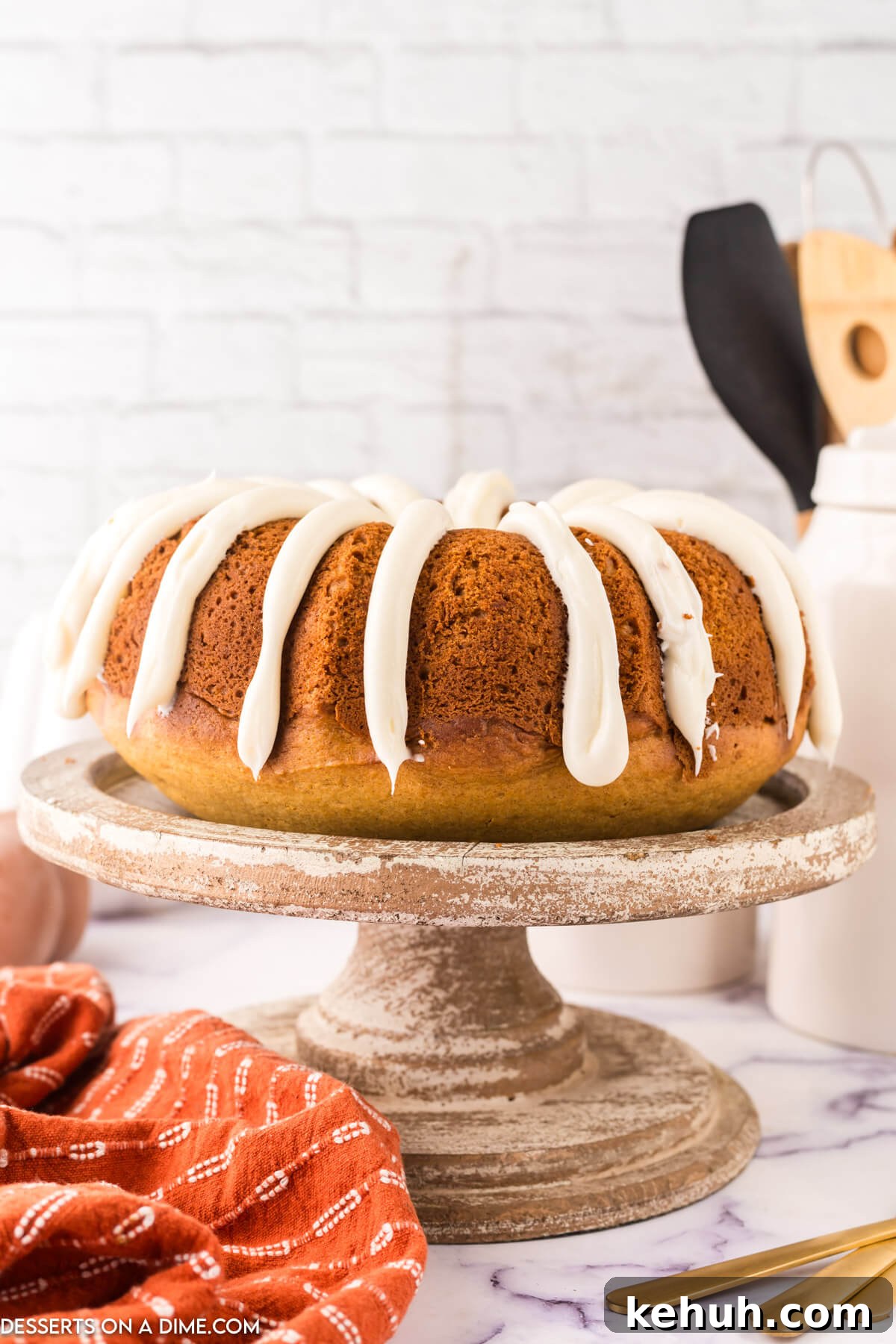 Moist Pumpkin Bundt Cake with Spiced Glaze 2 Pumkin Bundt Cake on a platter.