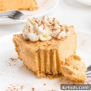 Moist Pumpkin Bundt Cake with Spiced Glaze 17 Pumpkin pie cheesecake sliced on a plate.