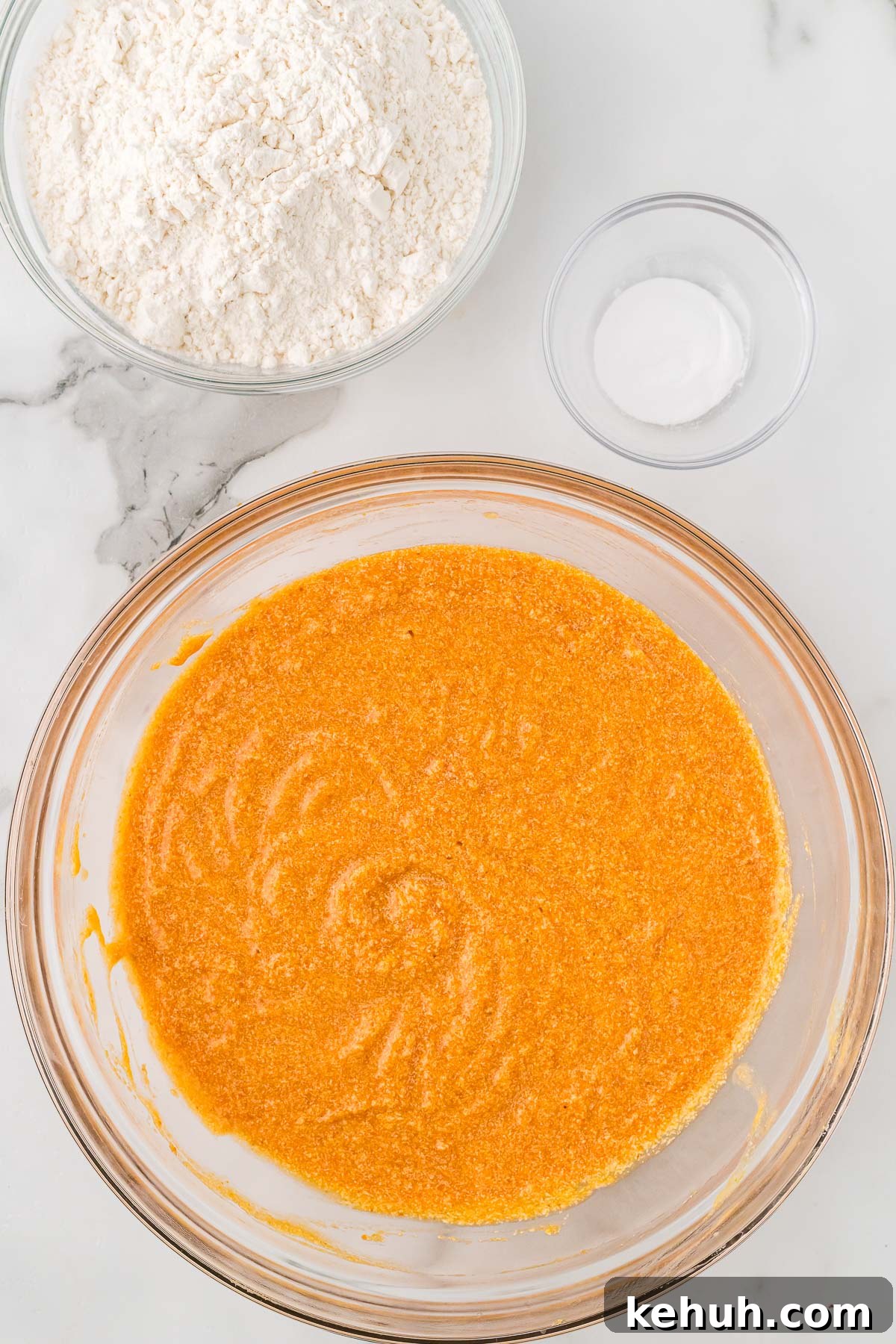 Moist Pumpkin Bundt Cake with Spiced Glaze 6 Mixing bowl with pumpkin mixture combined.