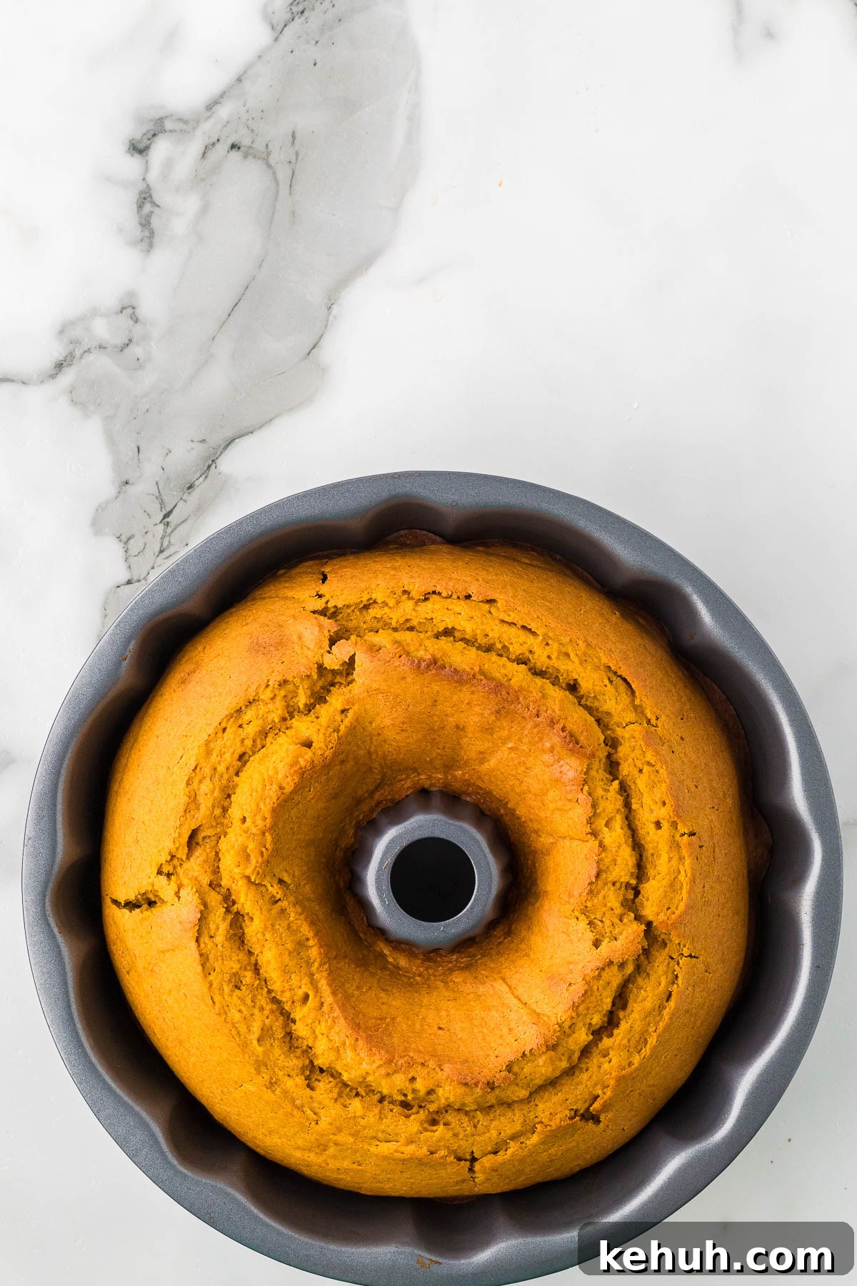 Moist Pumpkin Bundt Cake with Spiced Glaze 8 Cake baked and cooling.