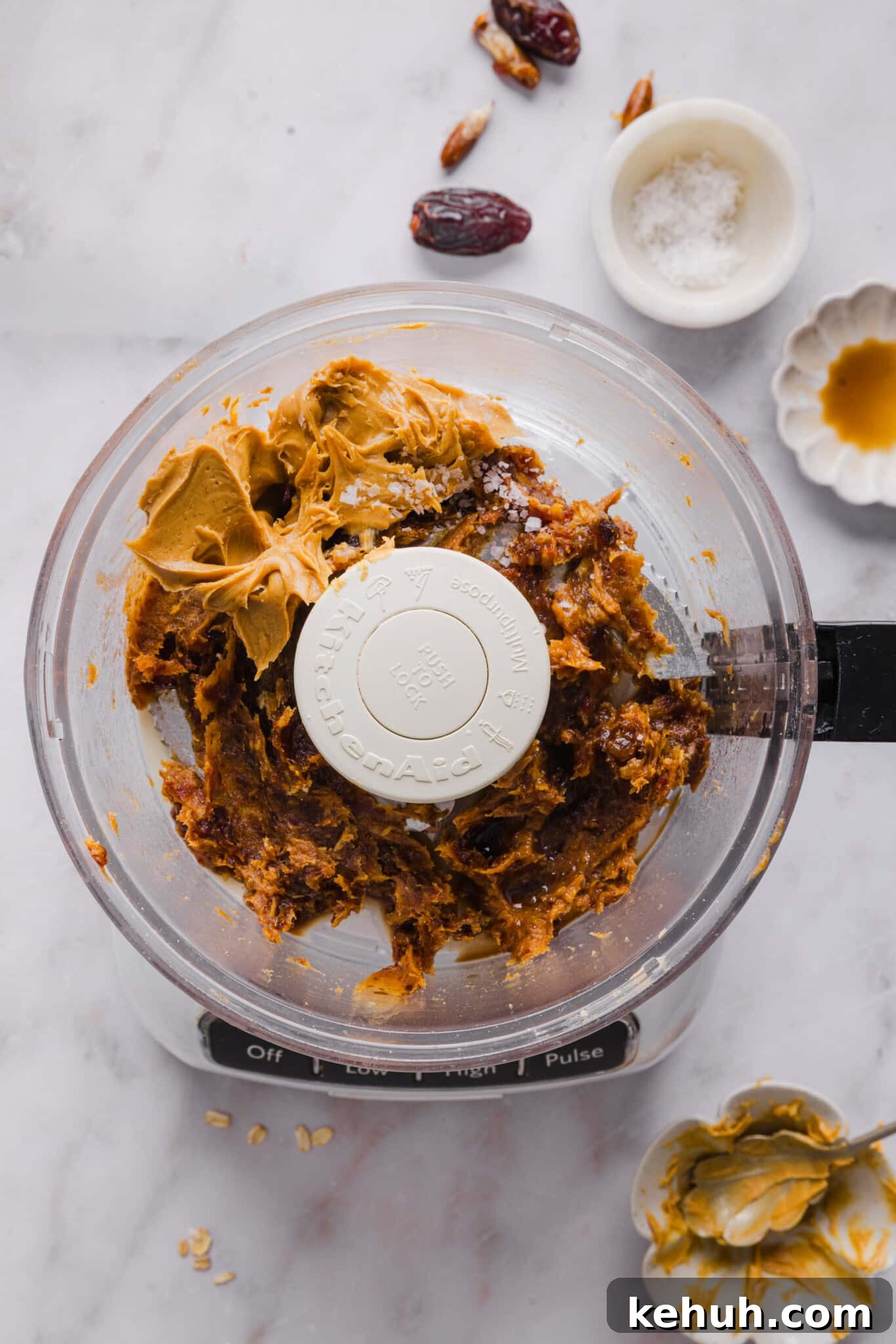 Dates and peanut butter in a food processor for date caramel.