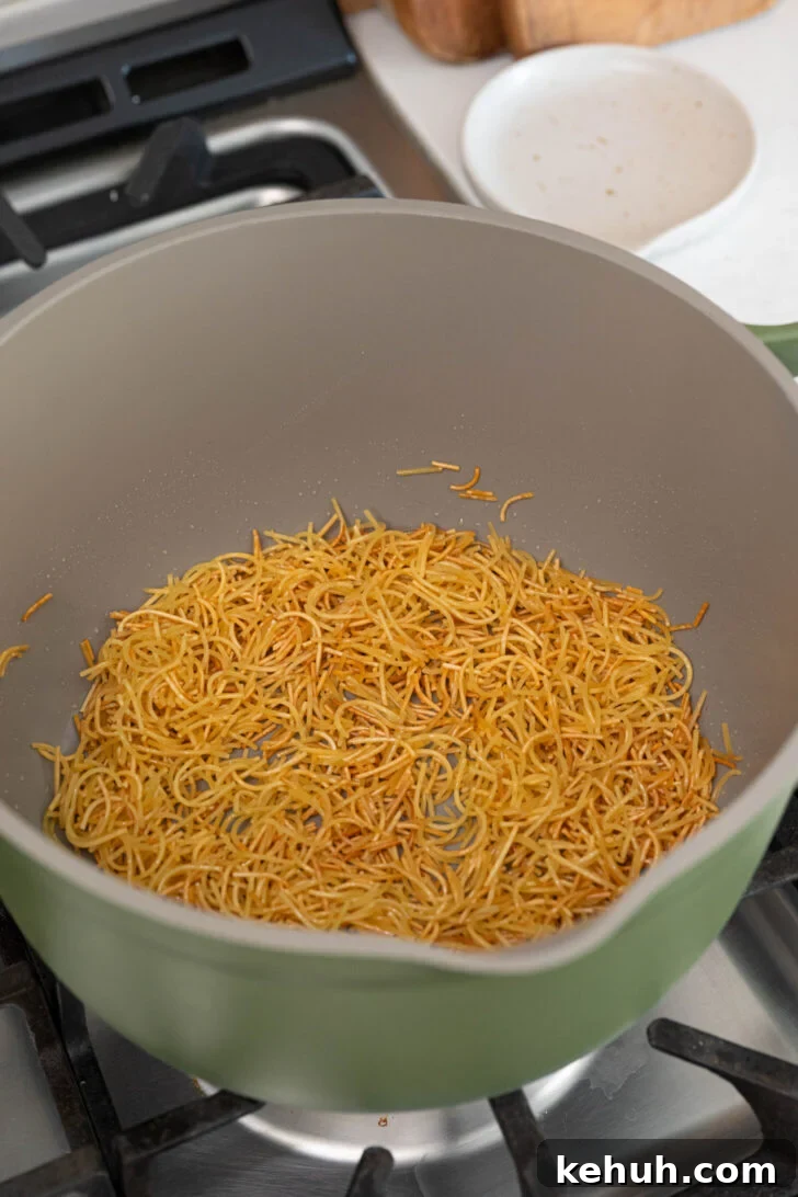 Sope de Fideo: Mexican Vermicelli Soup with Fresh Tomatoes 6 A pot with toasted fideo noodles.