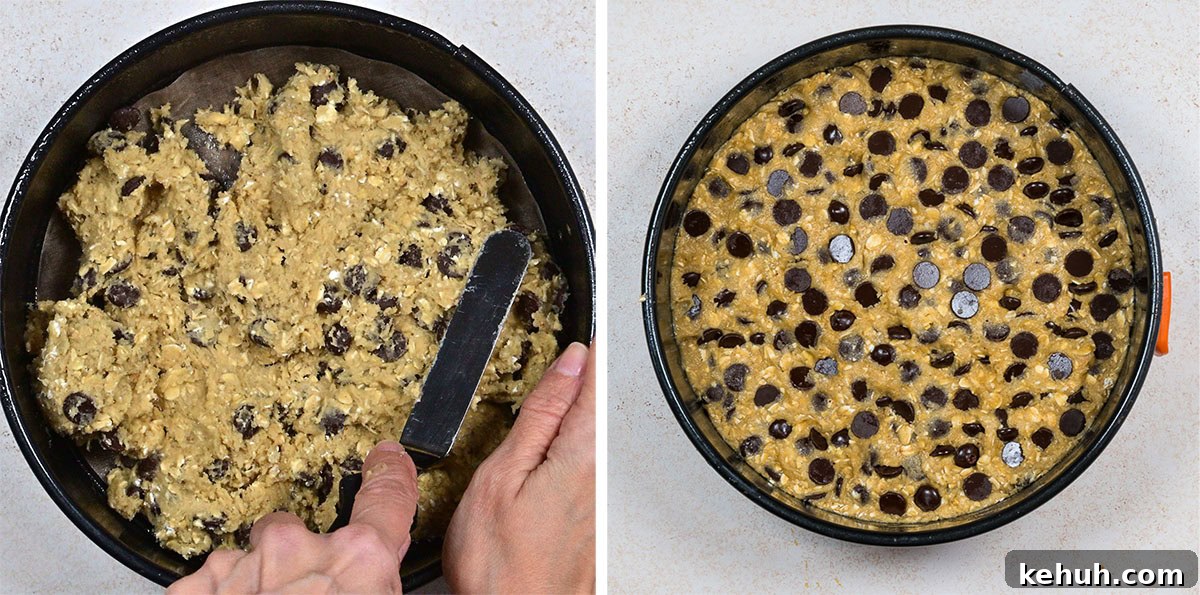 Two side-by-side images show a round baking tin with biscuit dough; on the left, a hand spreads the dough with a spatula, and on the right, the dough is evenly spread and topped with chocolate chips.