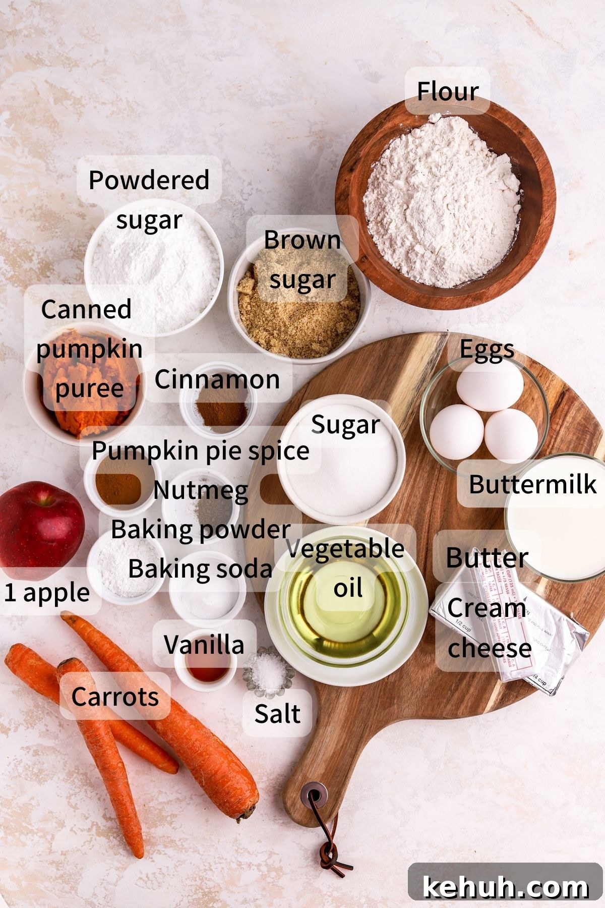 Moist Pumpkin and Carrot Layer Cake Recipe 3 Labeled ingredients needed to make pumpkin carrot cake laid out on a table.