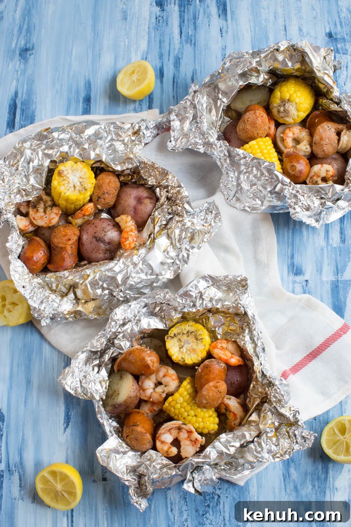 Low Country Boil Foil Pack Recipe for Seafood Camping Meals 2 Low Country Boil Foil Packs ready for the grill — less fuss and just minutes to assemble.